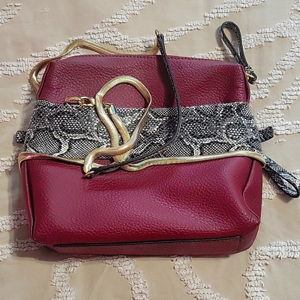 Snakeskin and gold embellished purse